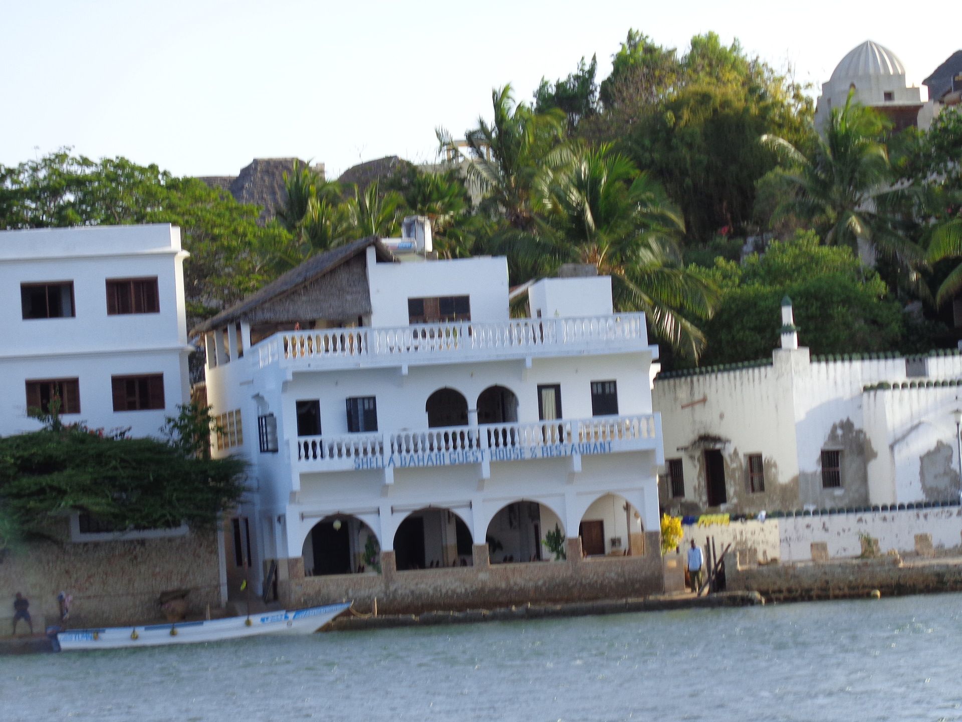 White-walled beachfront apartments on the waterfront in Lamu